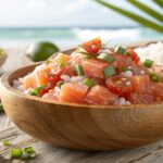 A bowl of Lomi Lomi Salmon with diced salmon, tomatoes, onions, and green onions