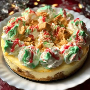 Festive Christmas tree cheesecake recipe with green whipped cream and red drizzle.