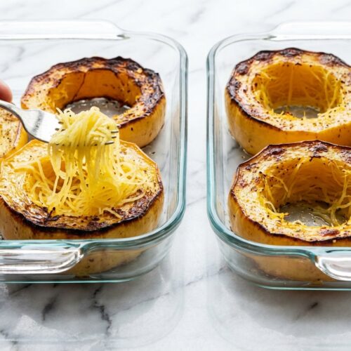 Baked Spaghetti Squash prepared with a cross-cut ring technique on a minimalist ceramic plate with soft shadows.