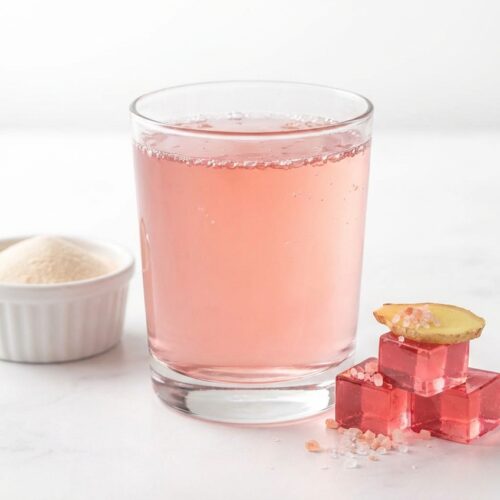Dr Oz gelatin recipe for weight loss in a minimalist bowl on white marble, infused with fresh ginger and pink salt.