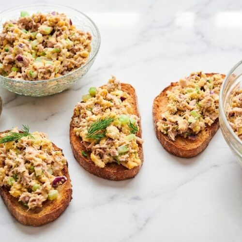 Tuna Salad (20g Protein) with a whipped cottage cheese binder in a minimalist ceramic bowl on white marble.