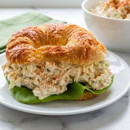 Creamy Old Southern Chicken Salad (25g Protein) with a smoked paprika boost in a minimalist ceramic bowl on white marble.